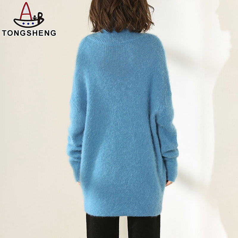 Back view of aqua blue turtleneck sweater on model