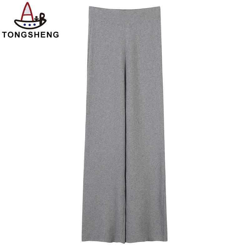 Grey knitted trousers with a ribbed weave for a loose fit