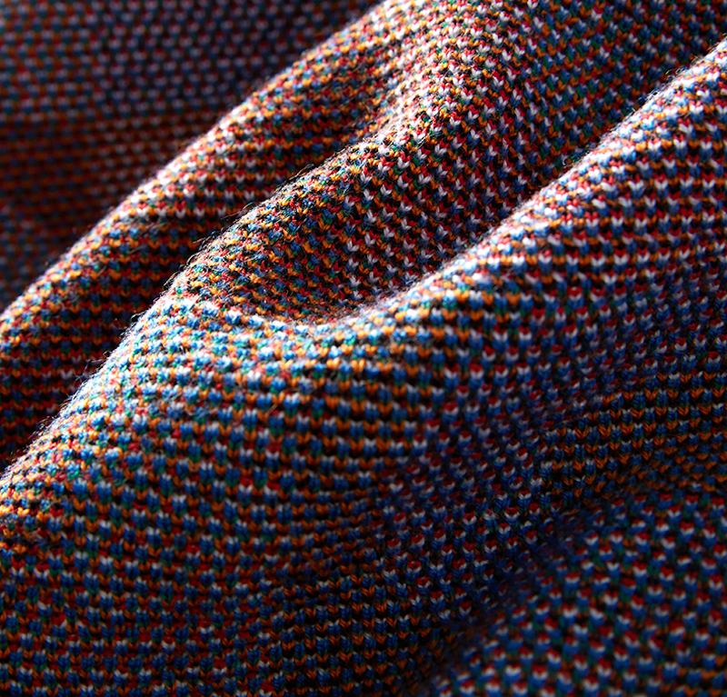The pattern of the crewneck sweater is shown with the details of the jacquard process
