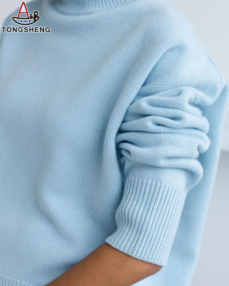 By folding the sleeves, you can see the comfort and softness of the sweater