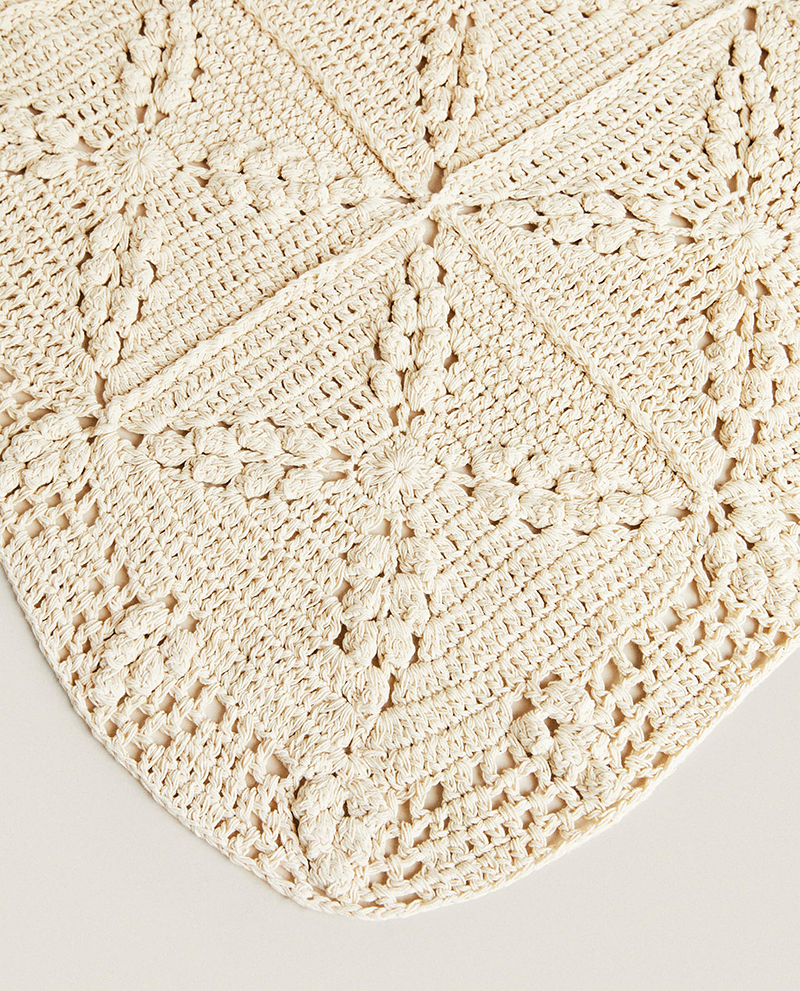 Cream crochet blanket is made up of square pieces