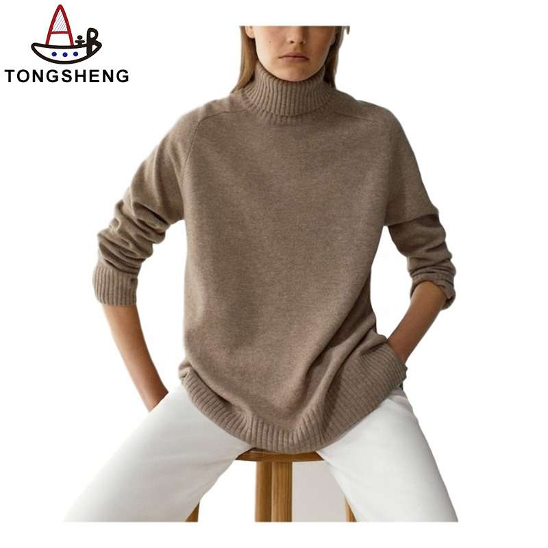 A camel loose turtleneck with white slacks is perfect for any occasion