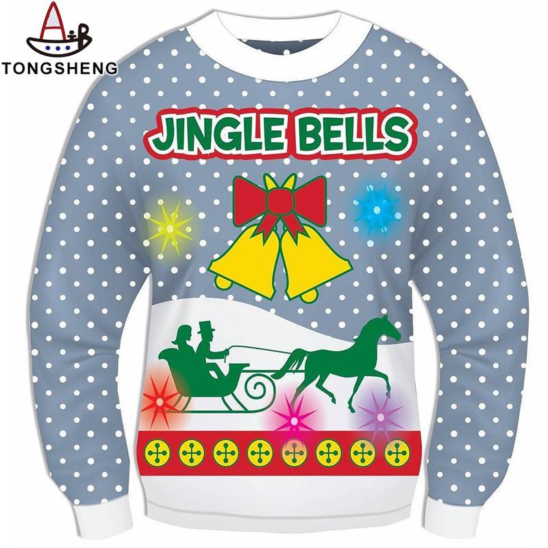 A clever combination of blue light toned sweaters and yellow bells makes a Christmas sweater cute and tacky.jpg