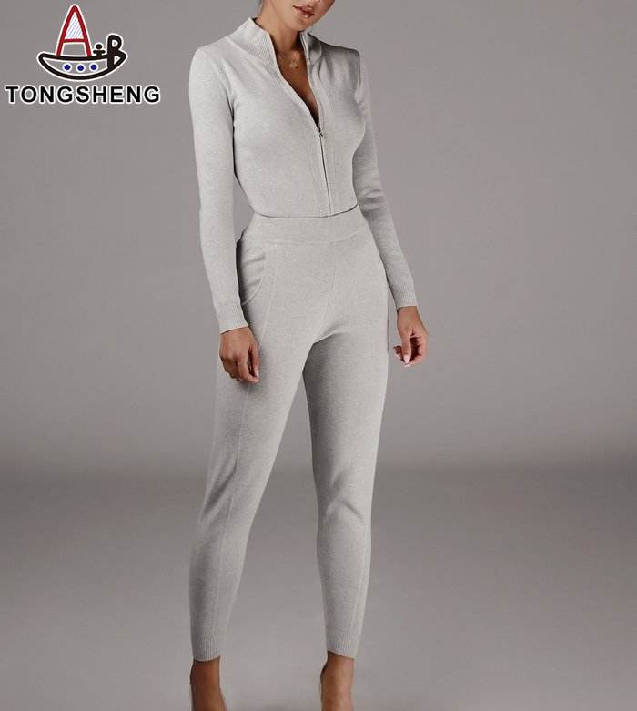 Classic suit with white sweater and trousers with zipper for casual comfort.jpg